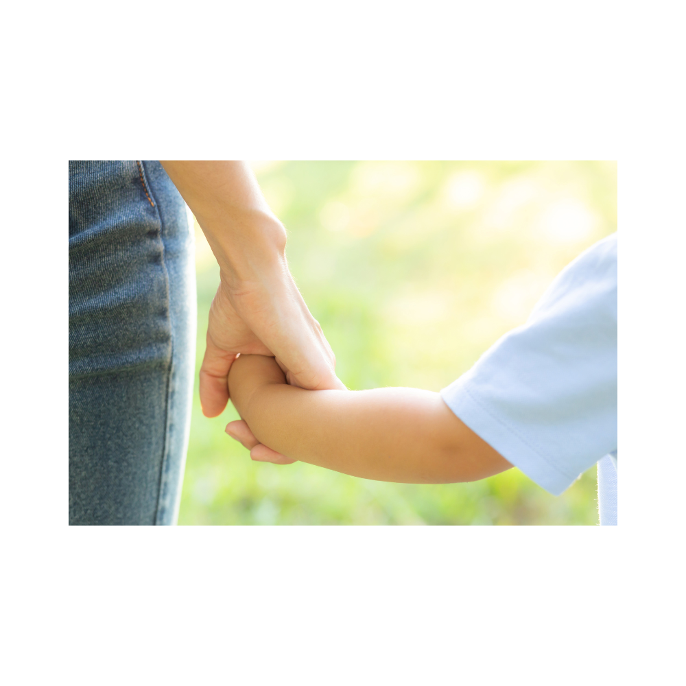 A family walking through a park, balancing parenting and mindfulness.